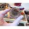 This shows the cedar rosette that decorates Mac's custom hat.